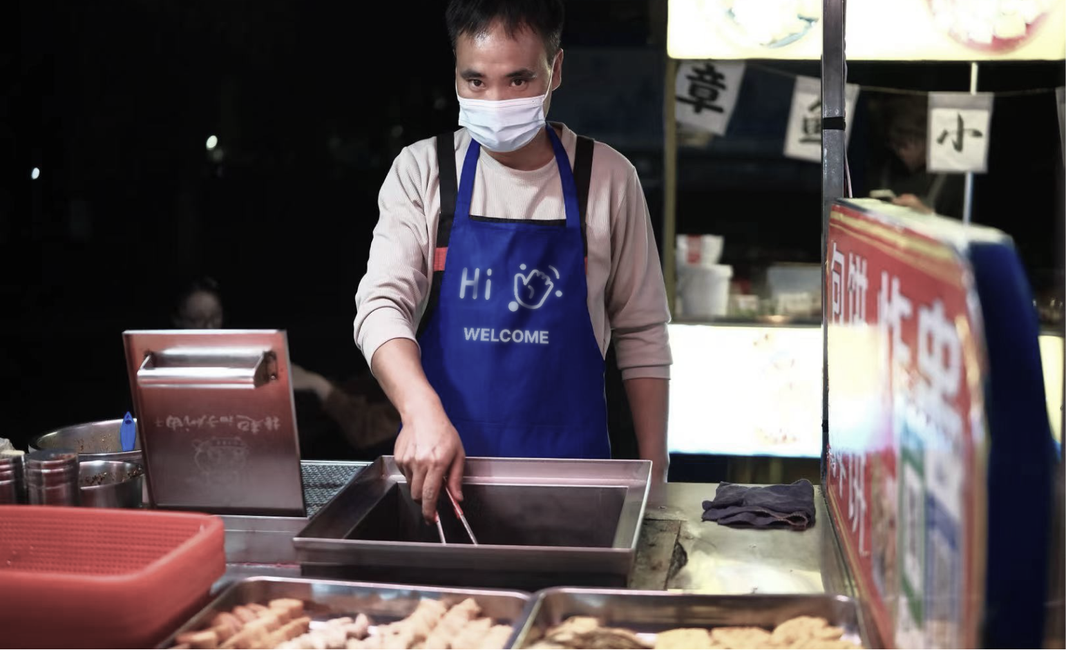 Vendor apron display showing a welcome greeting